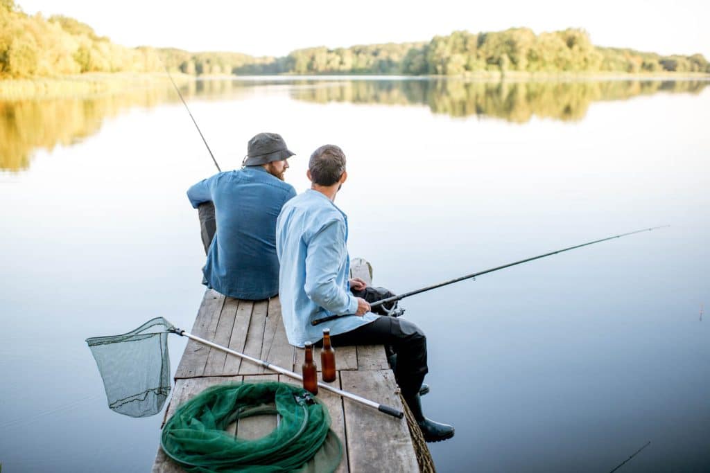 Two men fishing on the lake near Sierra Sol Mobile Homes For Sale Sparks